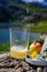 Glass of natural Asturian cider made fromÂ fermented apples, Asturian cabrales cow blue cheese with view on Covadonga lake and